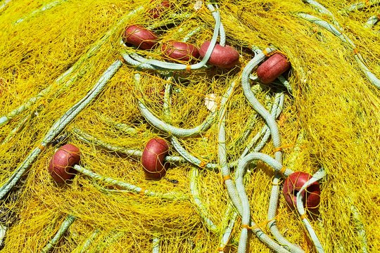 Yellow fishing net, detail, old harbour, Elounda, Crete, Greece, Europe