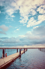 Obraz premium Color toned picture of an empty marina, travel concept.