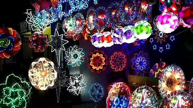 Handheld video shot of colorful Christmas lanterns on display at a store