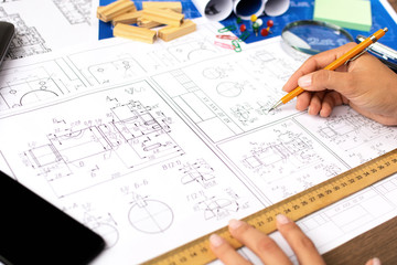 Architectural blueprints - drawings, pencil, calculator, calculations, plan, ruler, computer. Business and science.