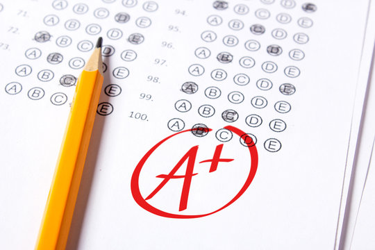 Good grade of A plus (A+) is written with  red pen on the tests.
