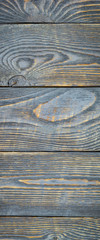 Vertical background from natural wood textured boards with traces of gray paint. Vignetting