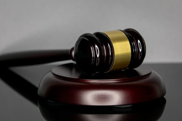 Judge's gavel on gray background. Court and the law concept