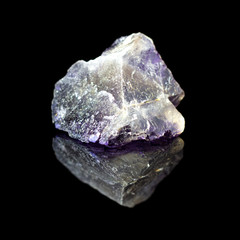 Natural untreated stone fluorite on a black backround