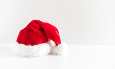 Santa Claus red hat on wooden white background. space for text 