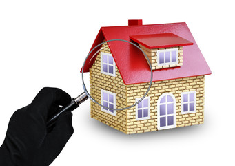 Magnifier in hand and a house with a red roof