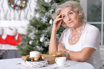 Portrait of a cute woman with cup of tea