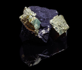 Natural cube pyrite on a black backgrond