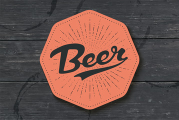 Coaster for beer with hand drawn lettering Beer. Monochrome vintage drawing for bar, pub and beer themes. Color coaster for placing a beer mug or a bottle over it with lettering. Vector Illustration
