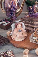 Chocolate brown cupcake with walnuts, cinnamon and honey on the Christmas table