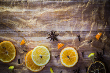 Citrus spices colorful background slices lemon orange cloves cinnamon