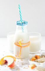 Housemade oat milk fruit nectarines white arrangement
