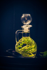 Olive oil bottle sprig rosemary
