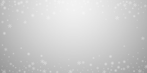 Sparse glowing snow Christmas background. Subtle f