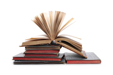 Stack of old antique books isolated on white background