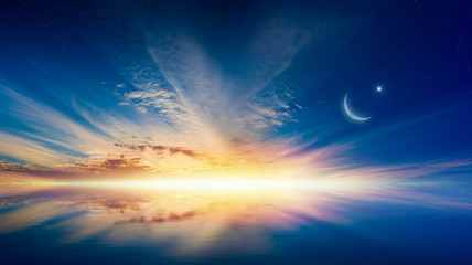 Ramadan Kareem background with crescent, stars and glowing horizon © IgorZh