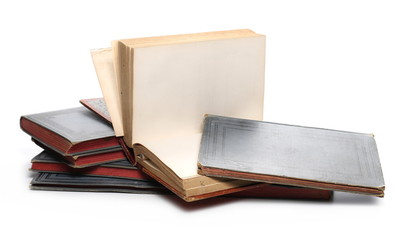 Stack of old antique books isolated on white background