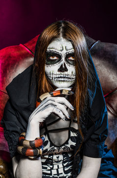 Beautiful halloween portrait and king snake. Dead face.