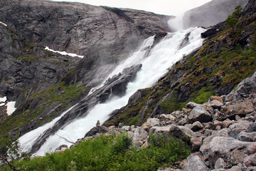 Sotefossen falls, the highest in cascade of four waterfalls in Husedalen valley, Kinsarvik, Norway