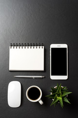 Office or business accessories on black background