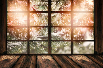 Blurred background of winter window landscape and shabby table place. Winter homely and cozy atmosphere. Christmas homely concept.
