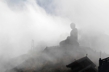Fototapeta na wymiar A statue of Buddha at the top of Fansipan mountain