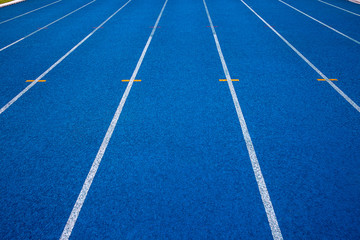 Blue running track in stadium. rubber running tracks in outdoor stadium. 
