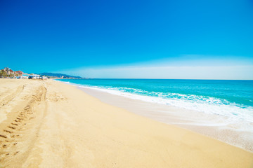 Fototapeta na wymiar Beach, sand and blue ocean. Summer Background. Copy space.