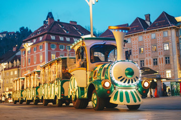 Children trackless train in Graz main Christmas Market in front of the city hall