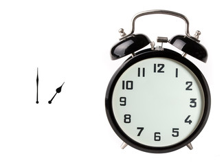 Iconic alarm clock and clock hands isolated on white