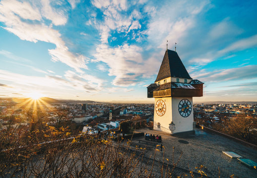 Graz city landmark Schlossberg park tower at sunset and city panorama