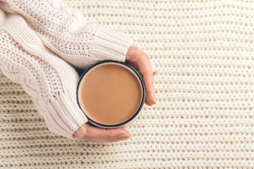 Female hands holding cup of hot cocoa
