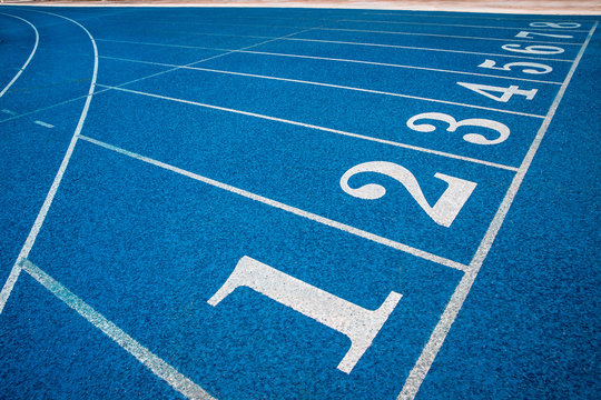 Blue running track in stadium. rubber running tracks in outdoor stadium. 