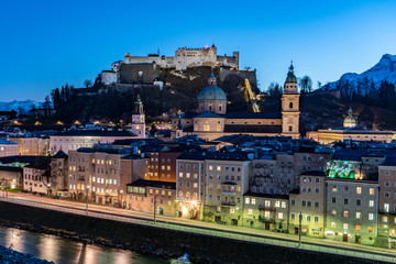 Fototapeta na wymiar Salzburg by night panoramic view with the Salzburg Fortress and the Cathedral visible