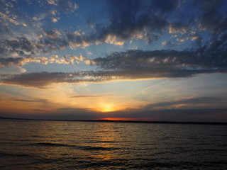 Sunset. On the big river. Coast. Beautiful clouds. Summer. Russia, Ural, Perm region