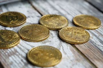 Gold Bitcoin money on wooden table. Electronic crypto currency