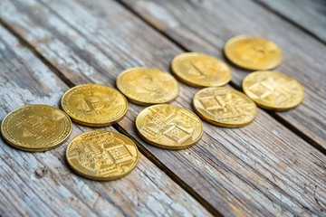 Gold Bitcoin money on wooden table. Electronic crypto currency