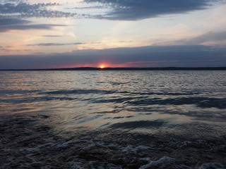 Sunset. On the big river. Coast. Beautiful clouds. Waves. Summer. Russia, Ural, Perm region