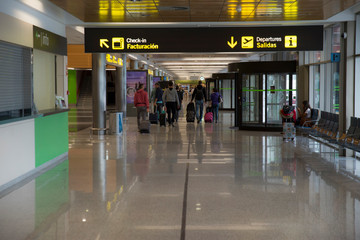 Group of people walking in the terminal of the airpor