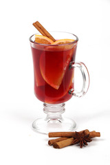 Winter hot drink with spices isolated on white background - christmas tea or mulled wine 