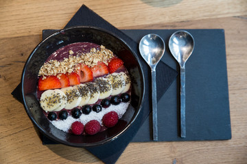Inviting gourmet yogurt with colorful pieces of tropical fruit