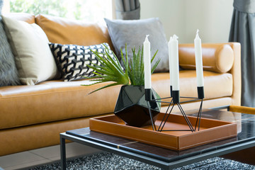 luxury cushion on brown leather sofa in modern living room.