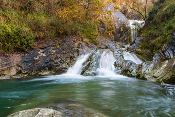 Obraz premium Waterfall and autumn colors. Magic of the Julian pre-Alps.
