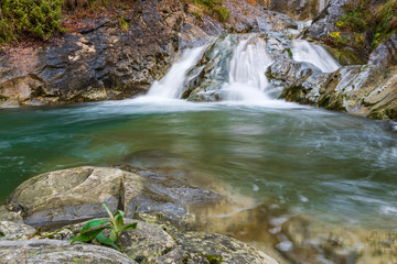 Waterfall and autumn colors. Magic of the Julian pre-Alps.