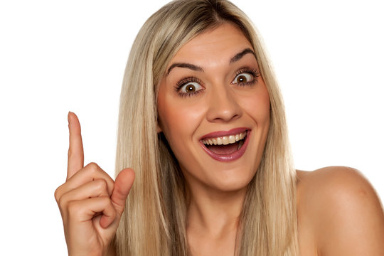 Portrait of young happy woman, showing finger up on white background