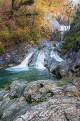 Waterfall and autumn colors. Magic of the Julian pre-Alps.