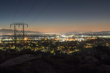 Los Angeles California dawn mountain view of power lines entering the San Fernando Valley.  The San Gabriel Mountains are in background.  