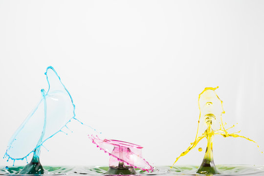 Splash of mixed color liquid with high speed flash