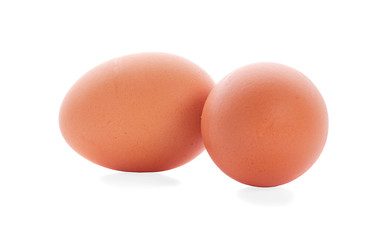 Two fresh hen eggs isolated against a white background.