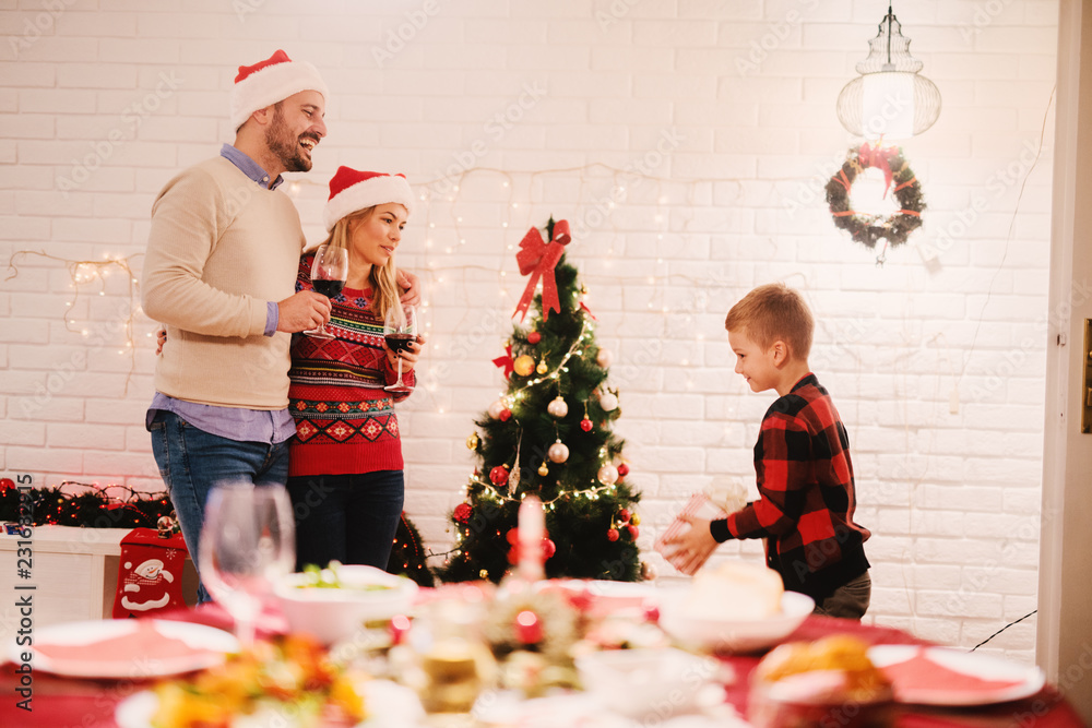 Wall mural Happy family christmas eve.